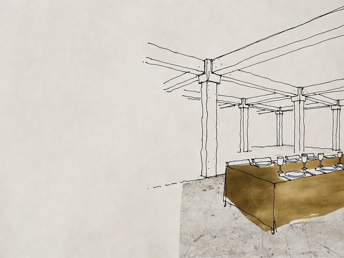 Mesa posta para convidados no meio de um interior de obra bruta
